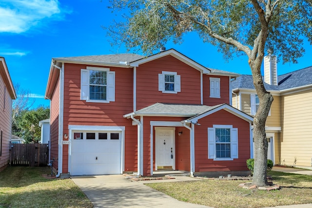 front of property featuring a garage and a front yard