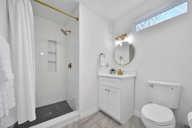 bathroom with vanity, toilet, and walk in shower