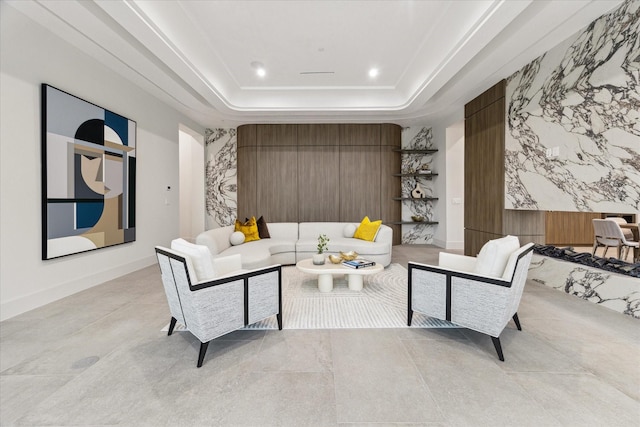 living room with a tray ceiling