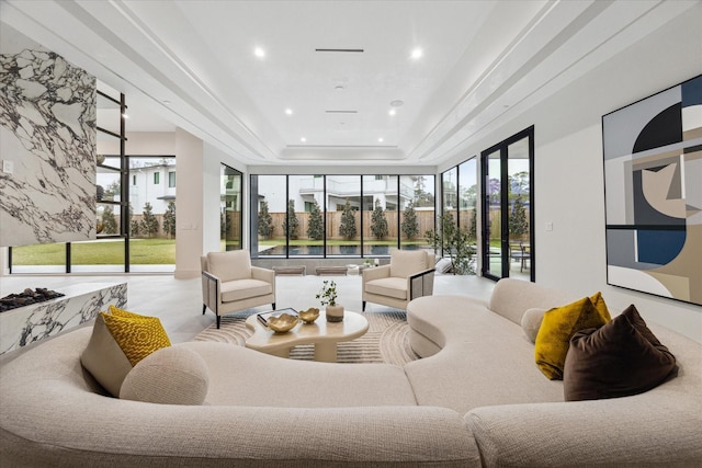 sunroom / solarium with a raised ceiling