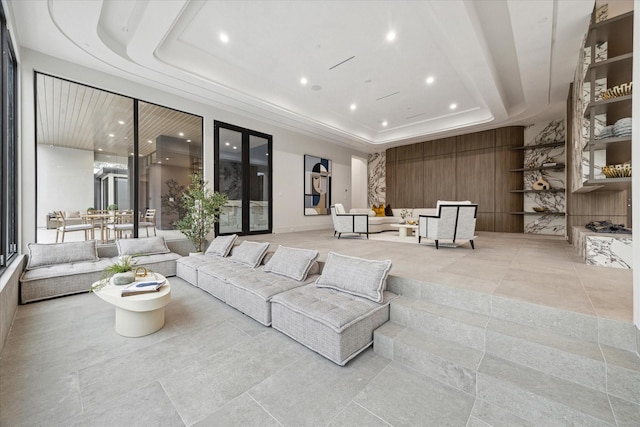 living room featuring a tray ceiling