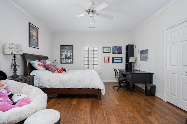 bedroom featuring ceiling fan, dark hardwood / wood-style flooring, and ornamental molding