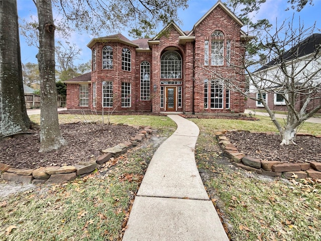 front facade with a front yard