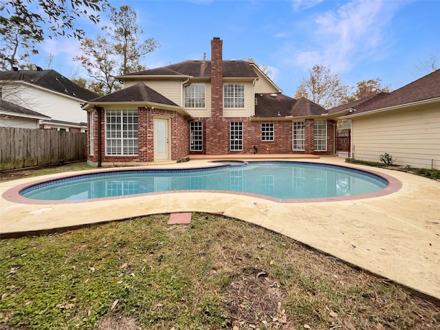 view of swimming pool with a patio