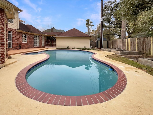 18418 Forest Elms Dr, Spring, TX 77388 - view of pool featuring a fenced backyard, a fenced in pool, a patio area, and a storage shed