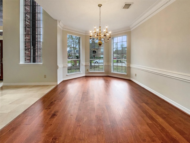 18418 Forest Elms Dr, Spring, TX 77388 - unfurnished dining area with crown molding, a notable chandelier, wood finished floors, and visible vents