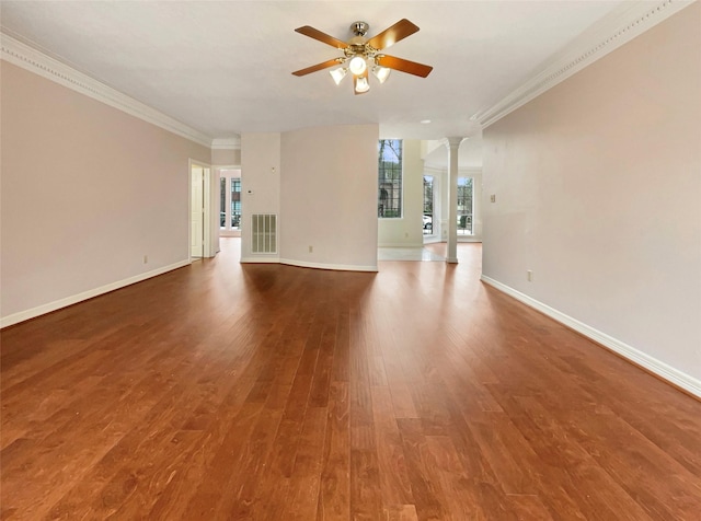 unfurnished living room featuring decorative columns, hardwood / wood-style flooring, crown molding, and ceiling fan