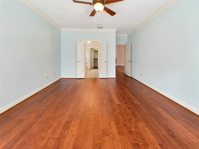 spare room featuring ceiling fan, hardwood / wood-style floors, and ornamental molding