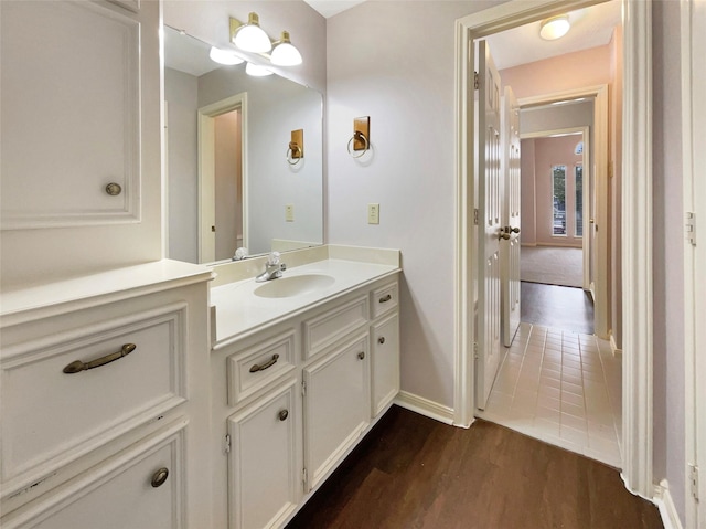 18418 Forest Elms Dr, Spring, TX 77388 - bathroom featuring baseboards, wood finished floors, and vanity