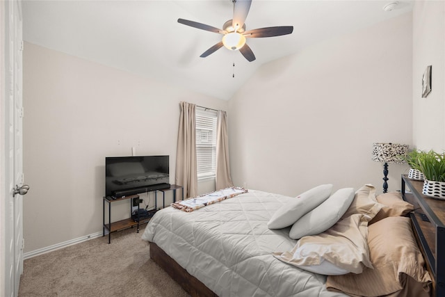 bedroom featuring light carpet, vaulted ceiling, and ceiling fan