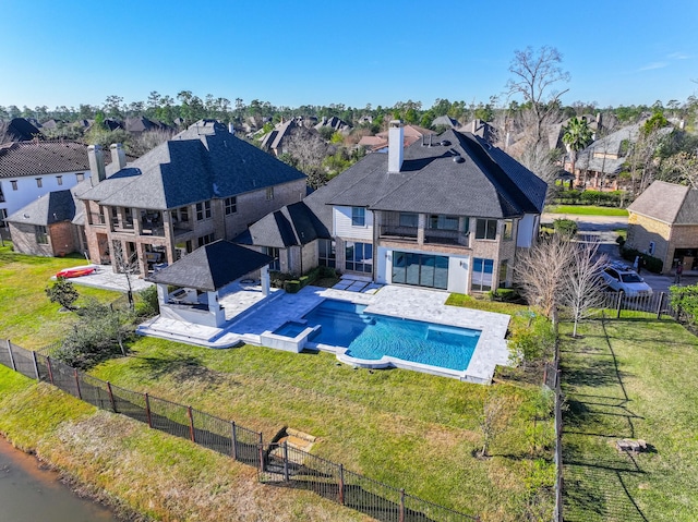 view of swimming pool with a yard, a gazebo, a patio area, and an in ground hot tub