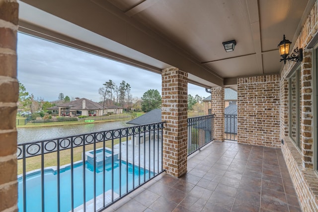 balcony featuring a water view