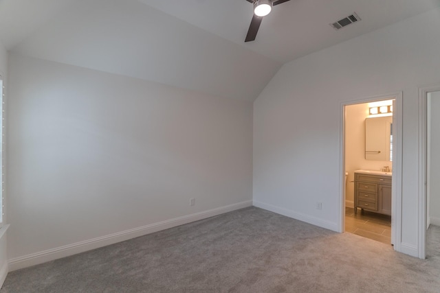 additional living space featuring lofted ceiling, light colored carpet, and ceiling fan