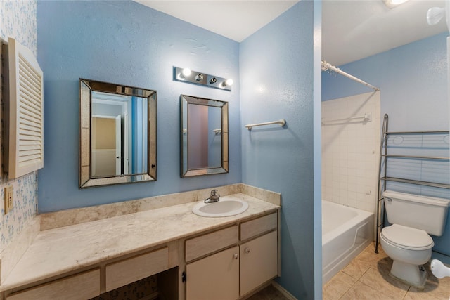 full bathroom with toilet, vanity, tiled shower / bath combo, and tile patterned flooring