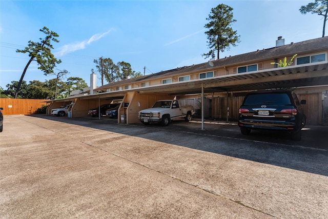 view of vehicle parking featuring a carport