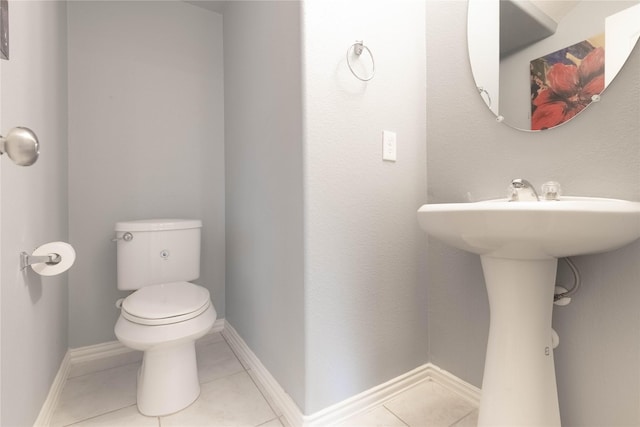 bathroom featuring tile patterned floors and toilet