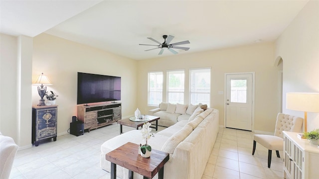 living room with ceiling fan and light tile patterned flooring