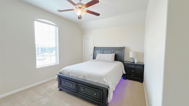 bedroom with ceiling fan, light carpet, and lofted ceiling