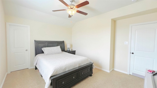 carpeted bedroom with ceiling fan and lofted ceiling