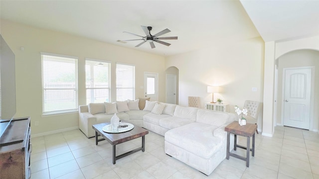 living room featuring ceiling fan and light tile patterned flooring