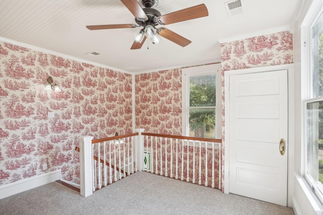 carpeted spare room featuring ornamental molding