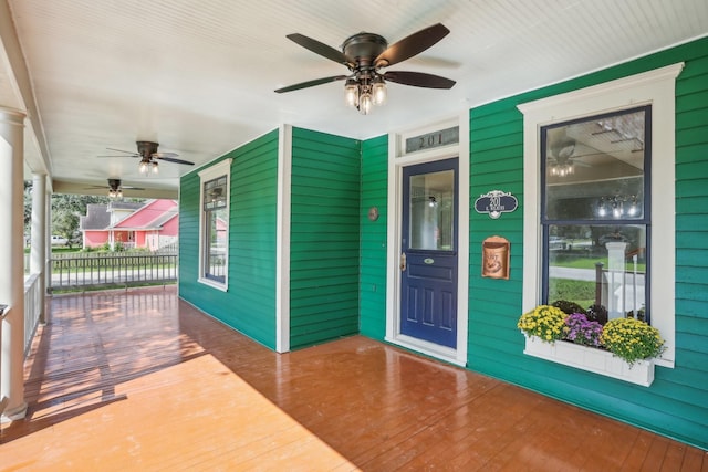 exterior space with a porch and ceiling fan