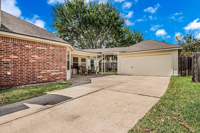 view of front of house with a patio and a garage