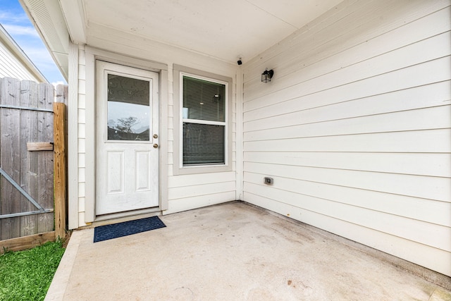 property entrance featuring a patio area