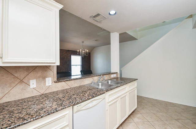 kitchen with white dishwasher, white cabinetry, light tile patterned floors, sink, and vaulted ceiling