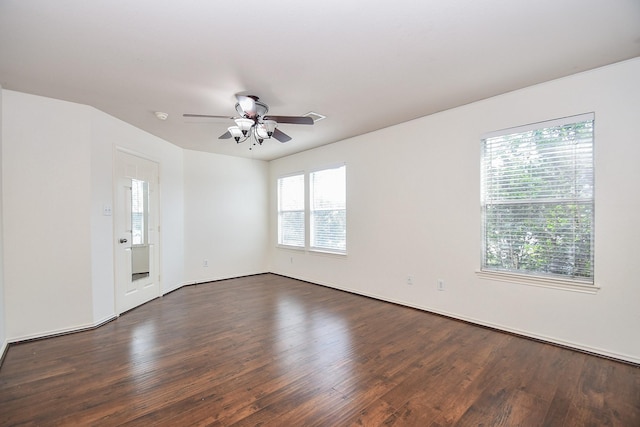 unfurnished room featuring ceiling fan and dark hardwood / wood-style floors