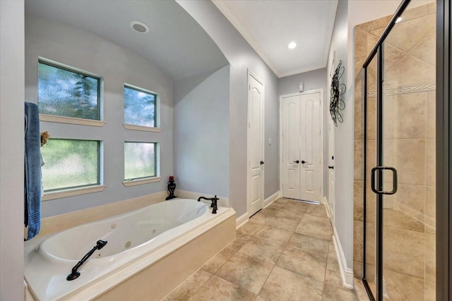 bathroom with crown molding and separate shower and tub