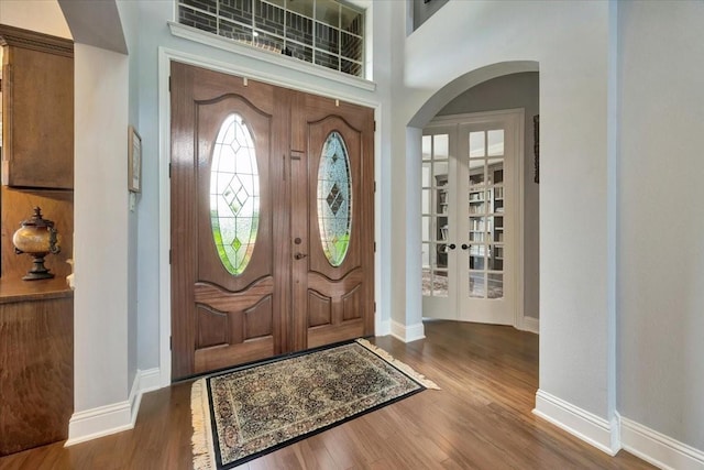 entrance foyer with dark hardwood / wood-style floors