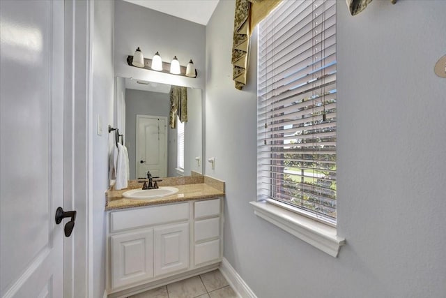 bathroom featuring tile patterned flooring and vanity