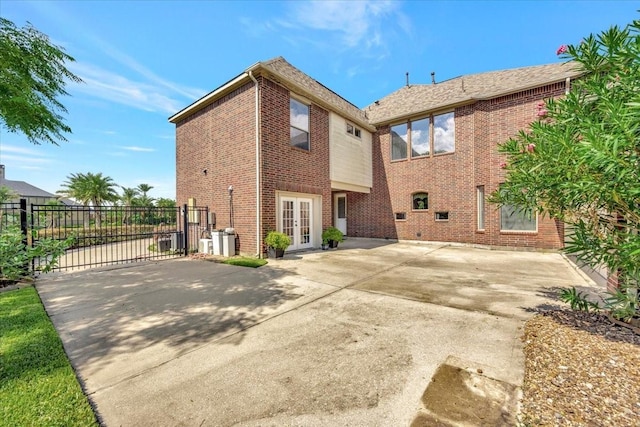 back of house with a patio and french doors