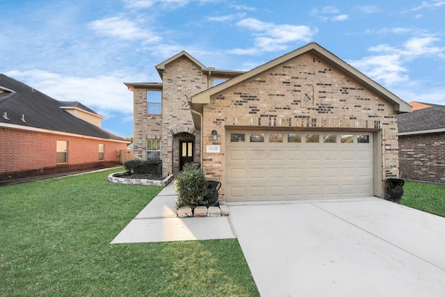 view of front of house featuring a garage and a front yard