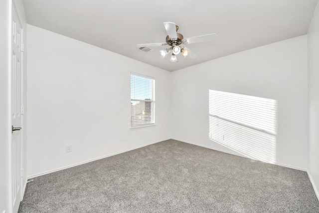 unfurnished room with ceiling fan and carpet floors