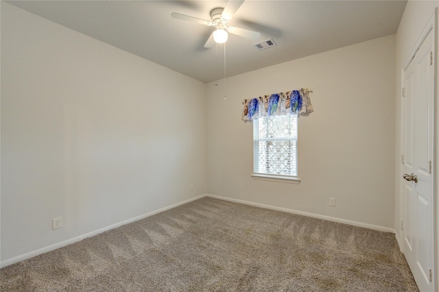 carpeted empty room with ceiling fan