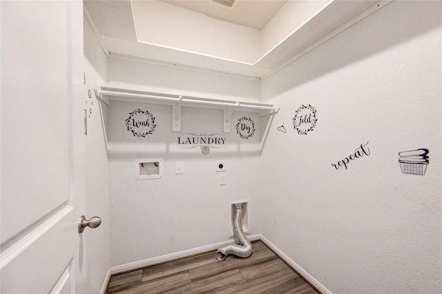 washroom with hardwood / wood-style flooring, washer hookup, and hookup for an electric dryer