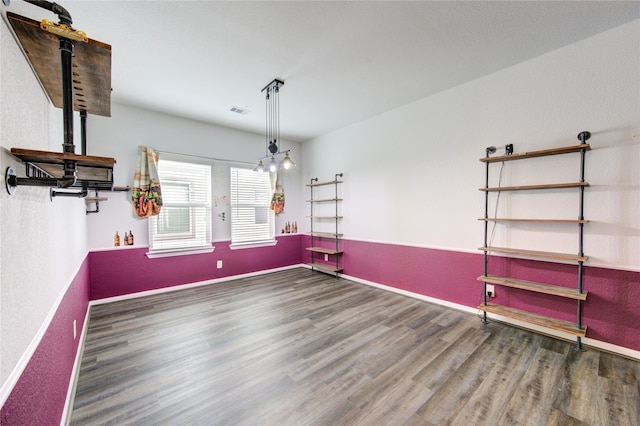 unfurnished dining area with dark hardwood / wood-style flooring