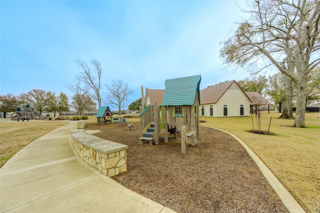 view of jungle gym featuring a lawn