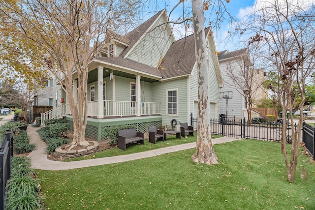 view of front of property with a porch and a front lawn