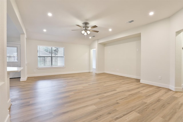 unfurnished room with ceiling fan and light wood-type flooring