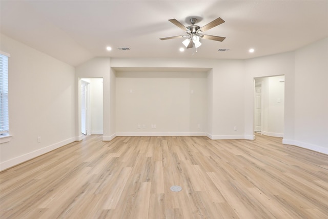 interior space featuring ceiling fan, vaulted ceiling, and light wood-type flooring