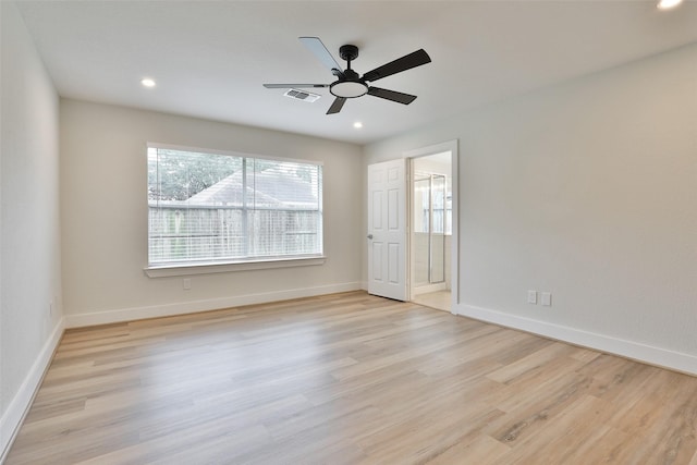 empty room with light hardwood / wood-style floors and ceiling fan