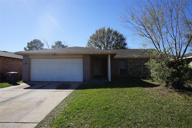 single story home with a garage and a front lawn