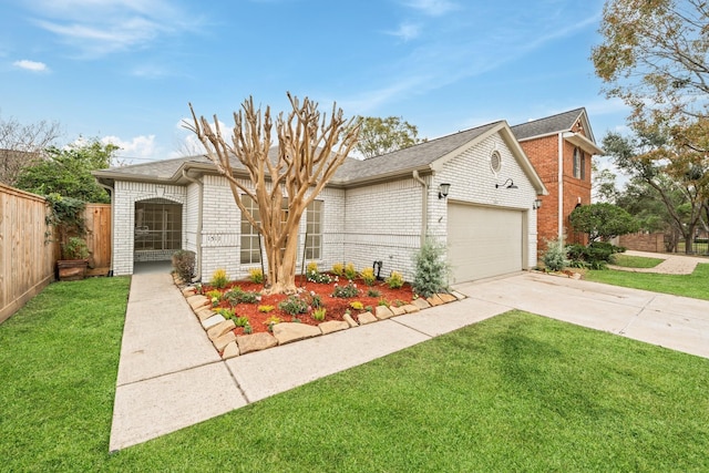 view of front facade with a garage and a front yard