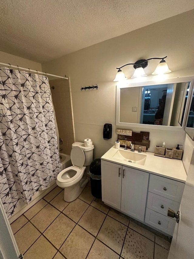 full bathroom with toilet, a textured ceiling, shower / tub combo with curtain, tile patterned flooring, and vanity