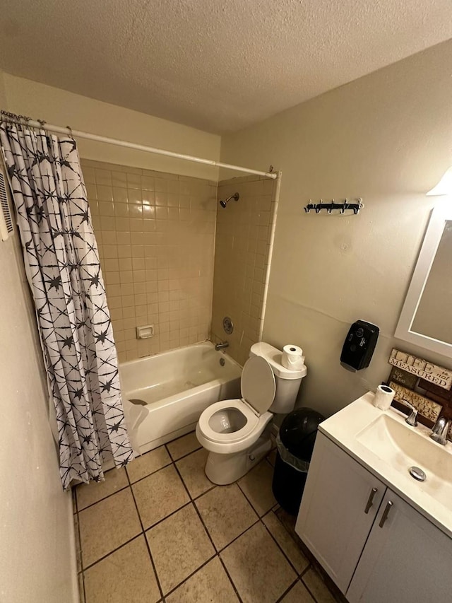 full bathroom featuring shower / tub combo, tile patterned floors, toilet, a textured ceiling, and vanity