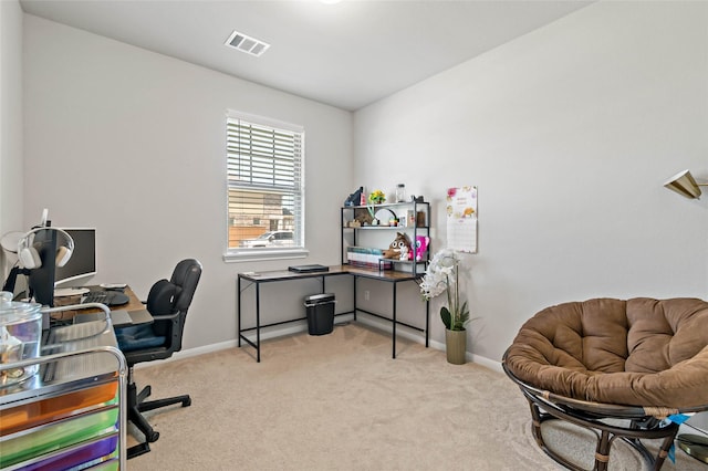 office area featuring light colored carpet