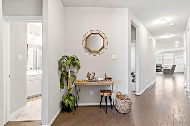 hallway with dark wood-type flooring